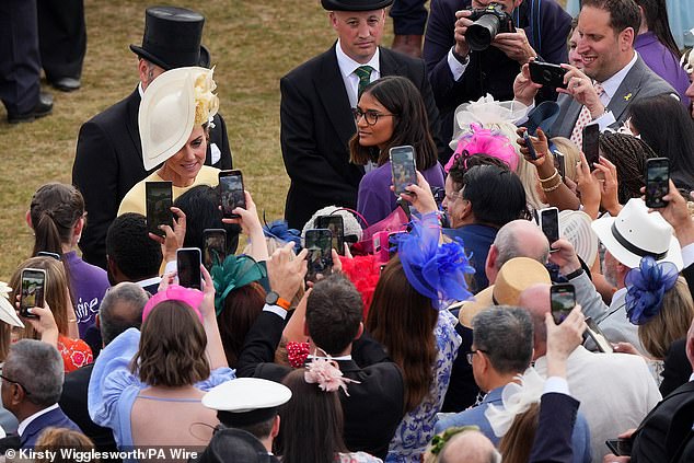 The Princess of Wales commanded attention in her lemon yellow ensemble, as she spoke to gathering crowds