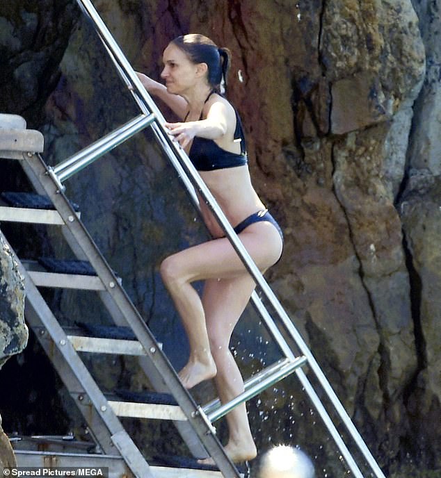 Portman walked up the steel steps to go up to the rocky cliffside