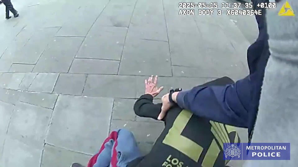 Police officer arresting a shoplifter.