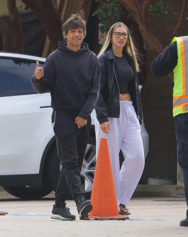 Louis Tomlinson and Zara McDermott holding hands in Malibu.
