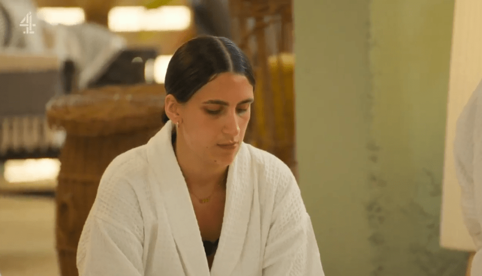 Woman in white bathrobe.