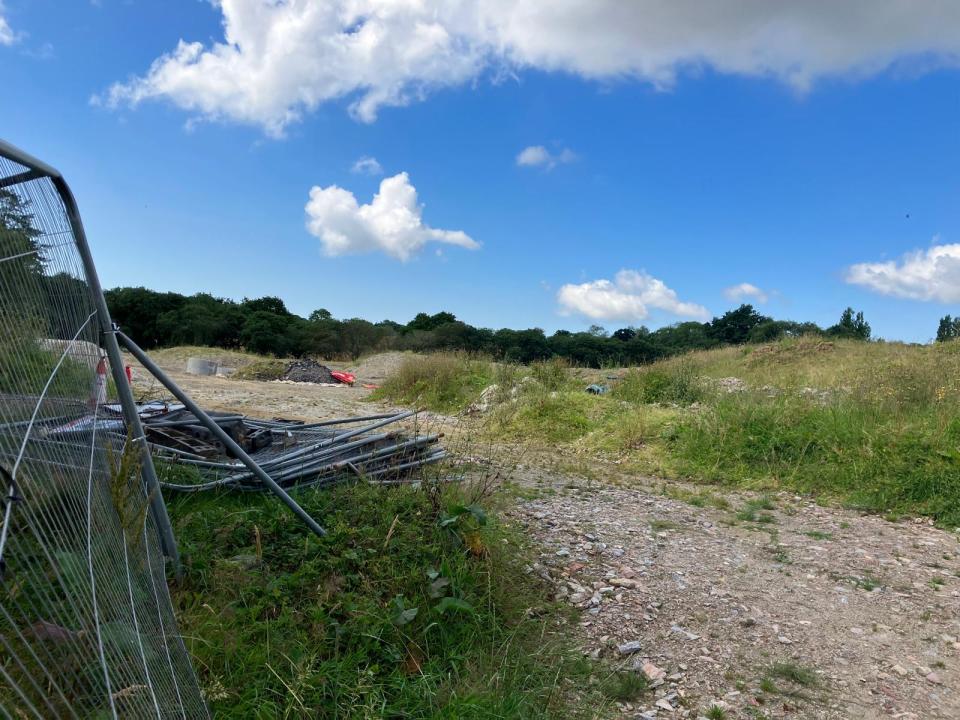 Wrecked fencing and building materials in Central Park, Plymouth, July 2024
