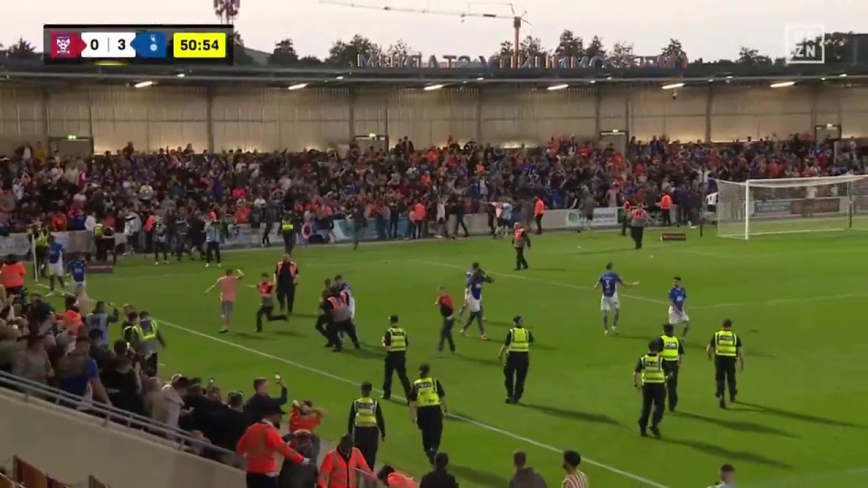 Oldham fans pitch invading after reaching the playoff final.
