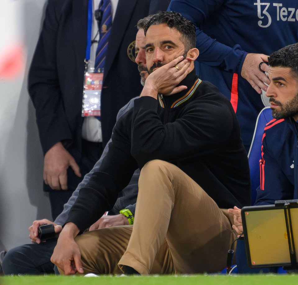 Manchester United manager Ruben Amorim sitting on the sidelines.