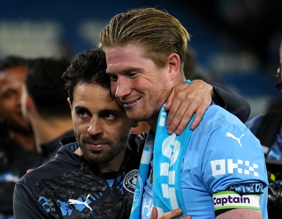 Kevin De Bruyne and Bernardo Silva embracing after a match.