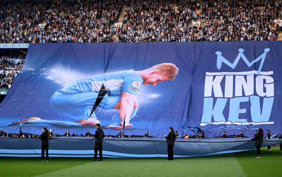 Tifo of Kevin De Bruyne unveiled at Etihad Stadium.