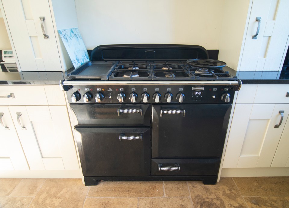 Black Rangemaster stove in a kitchen.