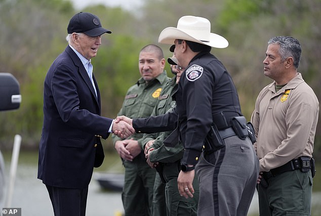 Biden signed executive orders in an effort to manage entries at border crossings. He was pictured here meeting with US Border Patrol officers in February 2024