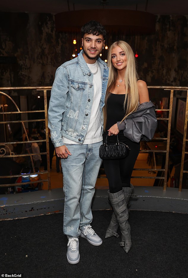 Princess looked stylish in a black jumpsuit wit knee boots and a grey leather bomber jacket