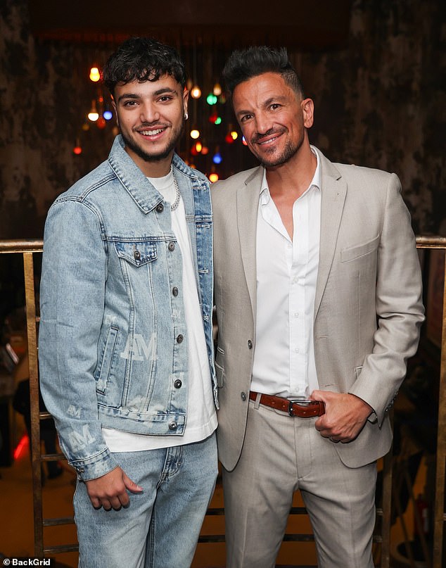 Meanwhile, junior opted for double denim and teamed a ligt blue jacket with a pair of distressed jeans