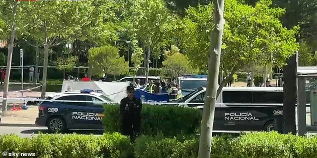 His body was still at the scene nearly two hours after the shooting and will be only be removed following authorisation from a judge