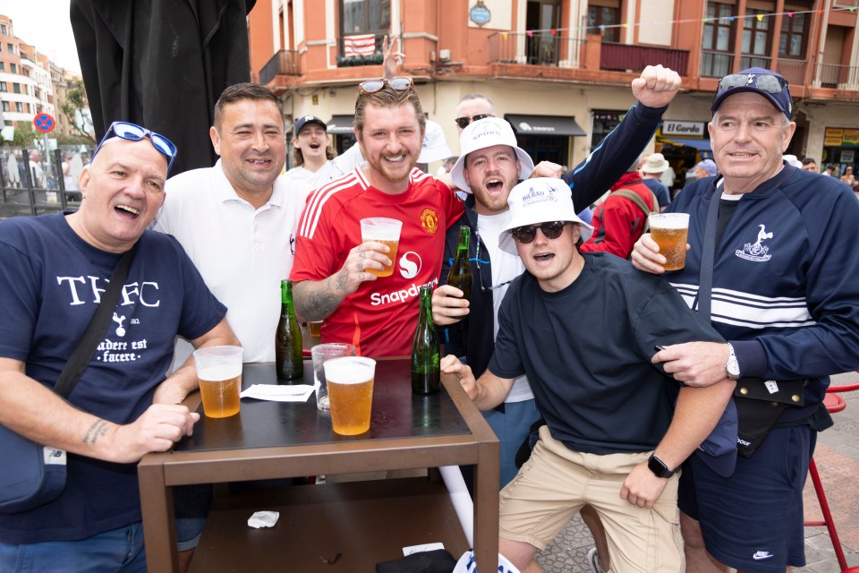 Tottenham Hotspur and Manchester United fans celebrating in Bilbao.