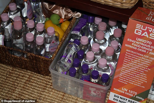 Dozens of bottles of baby oil and Astroglide lubricant were uncovered during the raid - as well as a box of nitrous oxide