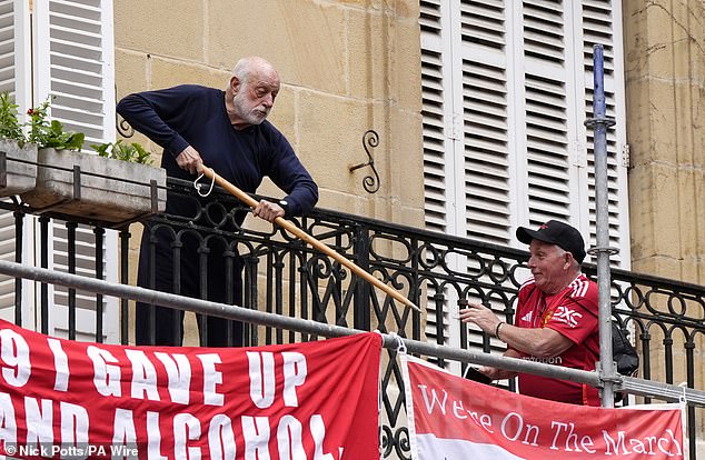 A resident protested against Man United fans putting up banners close to his apartment
