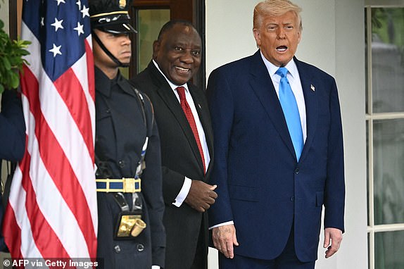 US President Donald Trump welcomes South African President Cyril Ramaphosa to the White House in Washington, DC, on May 21, 2025. South African President Cyril Ramaphosa meets Donald Trump on Wednesday amid tensions over Washington's resettlement of white Afrikaners that the US president claims are the victims of "genocide." (Photo by Mandel NGAN / AFP) (Photo by MANDEL NGAN/AFP via Getty Images)