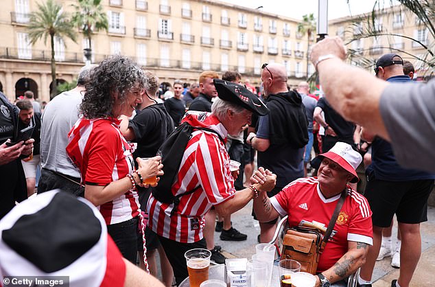 Some locals were cordial with the British visitors, including these Athletic Club fans