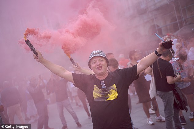 Manchester United fans let off red flares as their gathered in the build-up to Wednesday's final