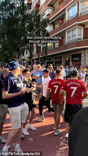 Footage on social media showed two Man United fans wearing Ronaldo shirts having beer thrown at them by Tottenham supporters