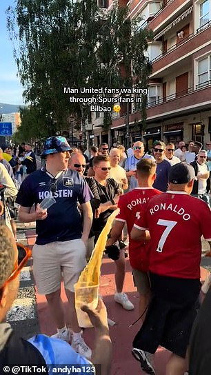 Footage on social media showed two Man United fans wearing Ronaldo shirts having beer thrown at them by Tottenham supporters