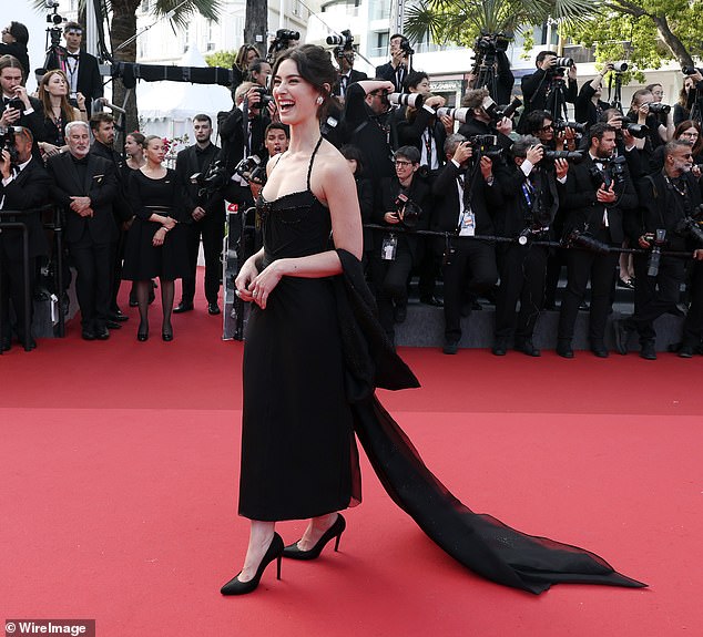 For the occasion, she put on a glamorous display in an understated black strapped gown with sequinned detailing across the bodice