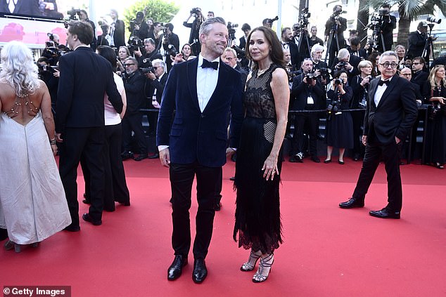 She added to her height in a pair of glamorous heels as she posed alongside her fiancé Addison O'Dea