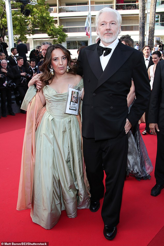 Julian Assange was also in attendance alongside his wife Stella, who wore a paper sign attached to her chest which appeared to be of Vivienne Westwood and read: 'Stop killing'
