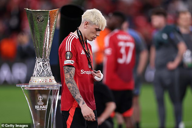 Manchester United's players cut comparatively dejected figures as they collected their medals