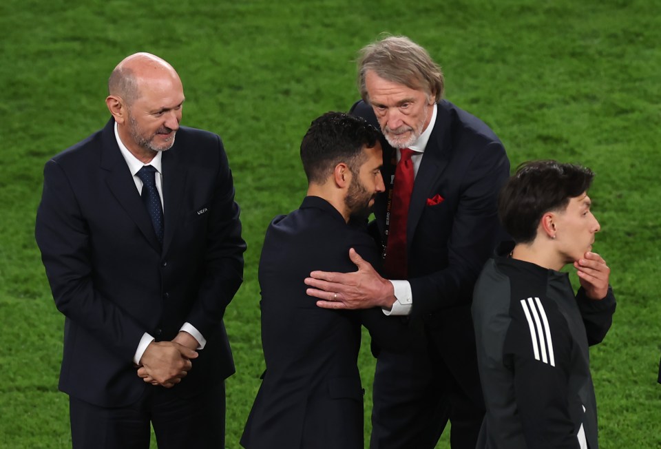 Manchester United's manager and co-owner embracing after a UEFA Europa League Final.