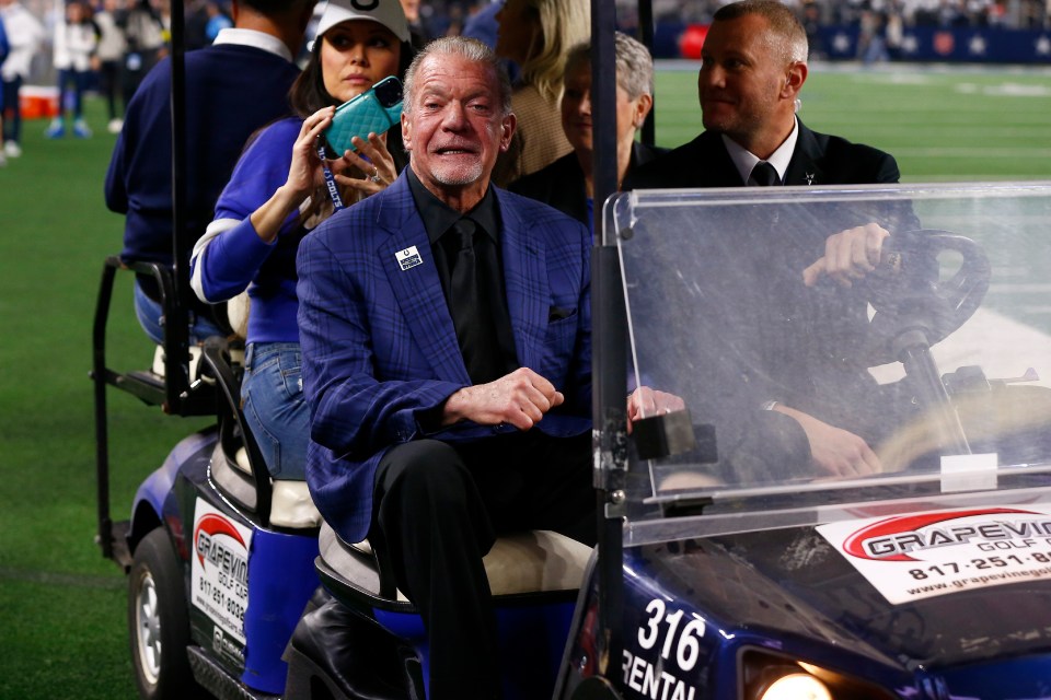 Jim Irsay, owner of the Indianapolis Colts, riding in a golf cart before an NFL game.