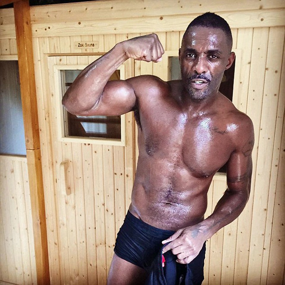 Idris Elba flexing in a sauna.