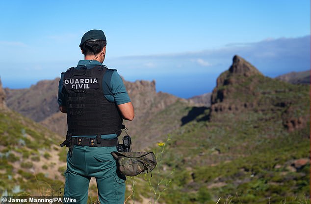 A police officer overlooks Masca in Tenerife during the search for Jay Slater on June 21, 2024