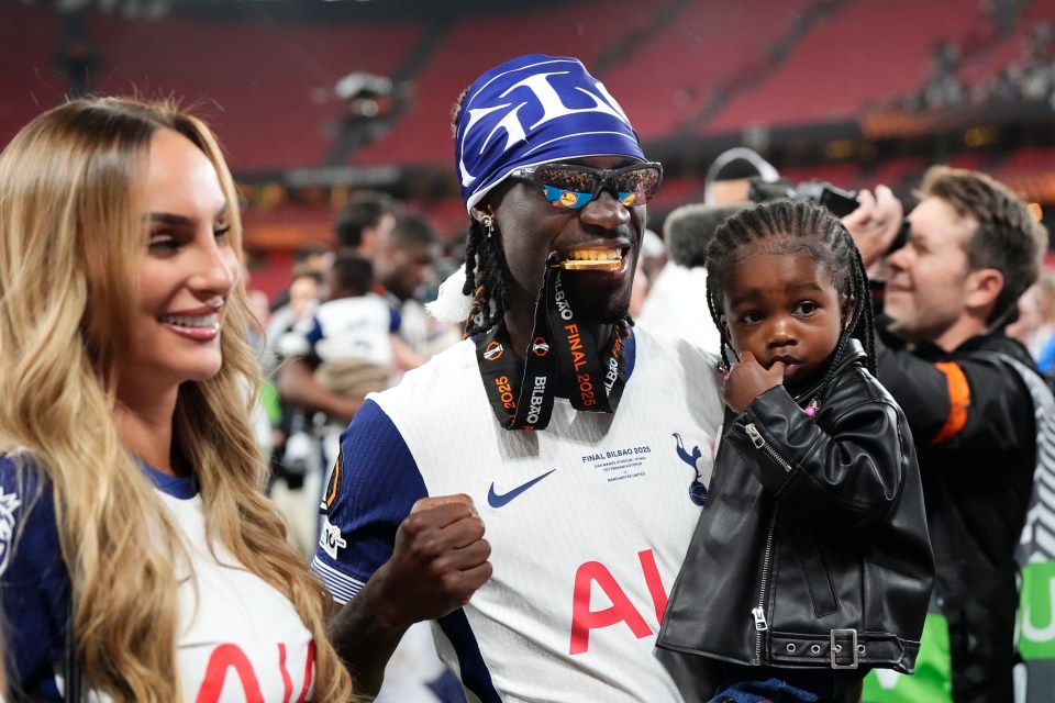 Yves Bissouma celebrates with his family after a UEFA Europa League victory.