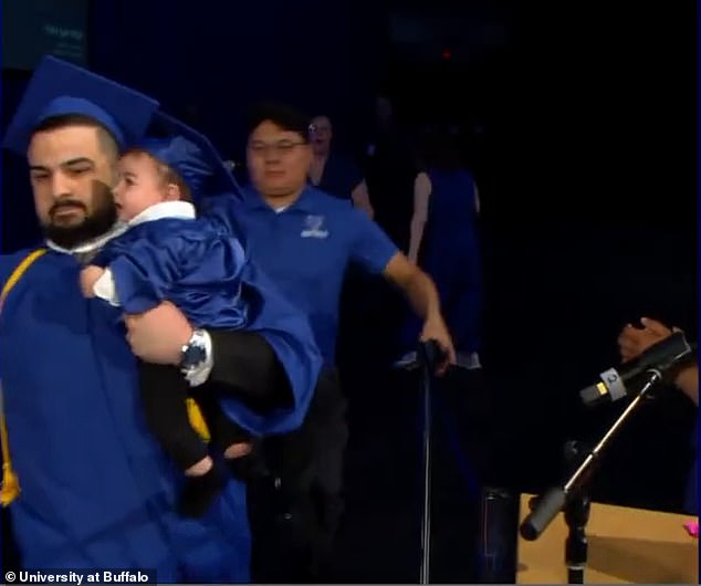 When the day arrived, his plans were abruptly derailed when event staff stopped him, citing a university policy listed on its website that stated only graduates were allowed on stage - but he made a promise to his son to walk with him