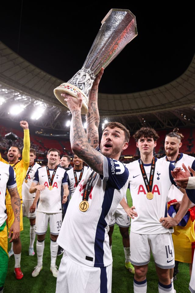 James Maddison of Tottenham Hotspur holding the Europa League trophy.