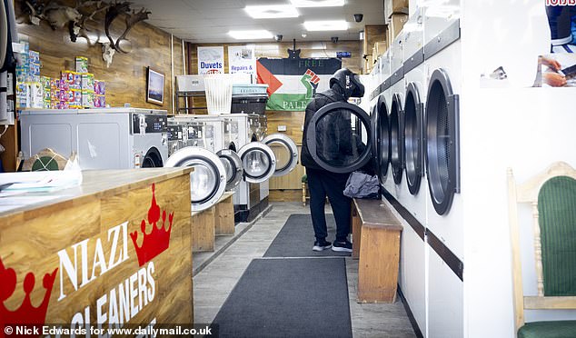 A launderette on the high street shows a Palestinian flag adorning the wall