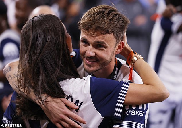The Tottenham midfielder, who was unable to play in the final embraced Kennedy in the post-match celebrations
