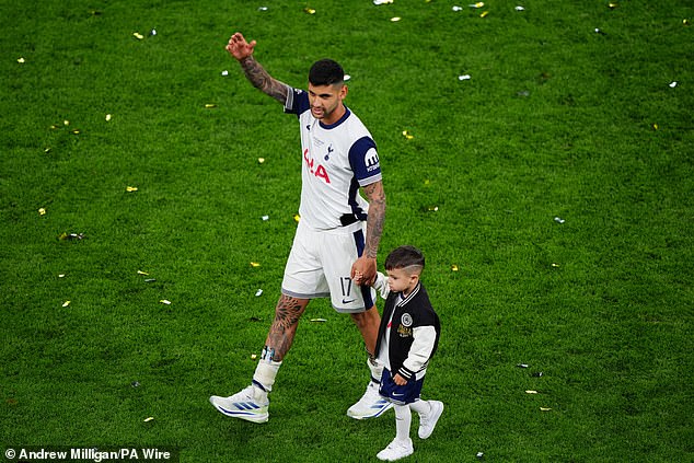Tottenham star Cristian Romero paraded around the pitch with his son post-match