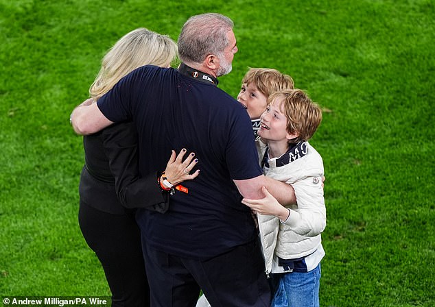 The Tottenham boss celebrated the victory with Georgia and two of their sons on the pitch