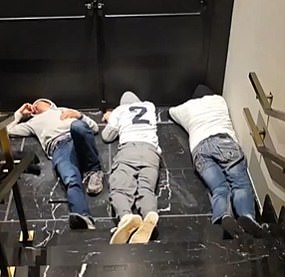 Spurs supporters sleep at the bottom of some stairs