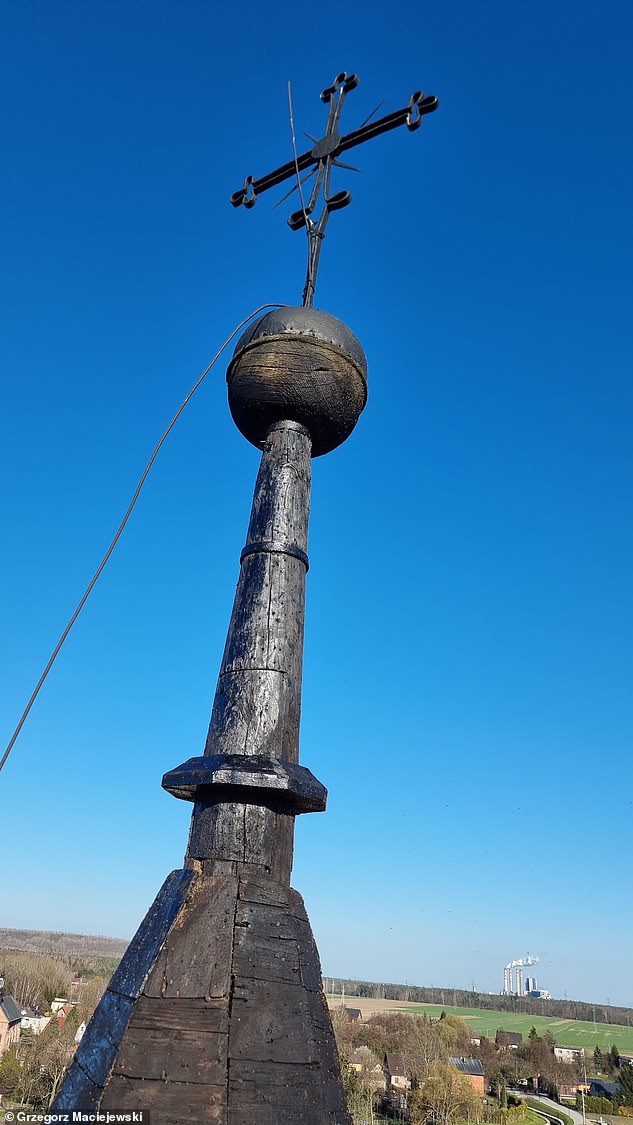 Builders stumbled across the letter detailing the hardships under Tsar Nicholas II while dismantling a cross on the monastery's gate tower overlooking the village