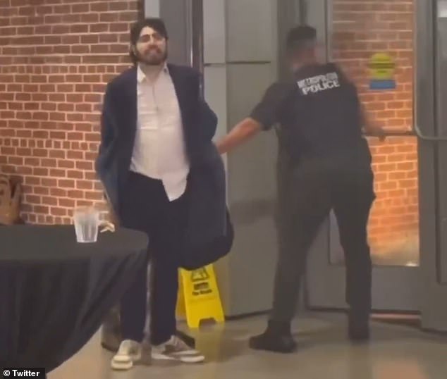 Footage captures the moment he is hysterically hauled away from the scene. 'Free, free Palestine,' he shouts repeatedly as he squirms against the officers' grip