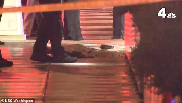 Items are left scattered on the sidewalk outside the museum after the horrific slaying