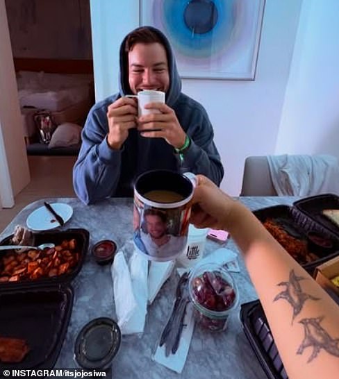 JoJo also showed off the gifts that Chris had given her for her birthday, a personalised mug featuring a snap from their time in the UK