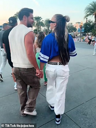 In JoJo's latest post, she included various clips from her birthday celebrations, including a brief shot of herself and Chris holding hands