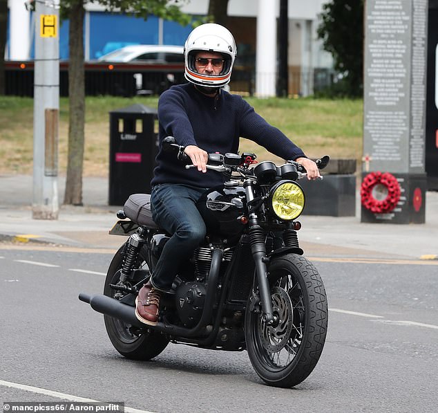Gethin added a pair of stylish shades as he kept his helmet's visor open