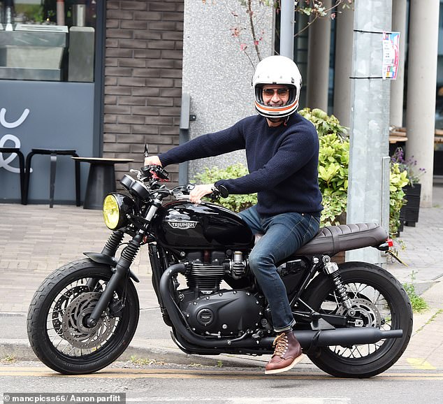 Gethin also beamed from his black Triumph Bonneville motorbike which costs £12,000