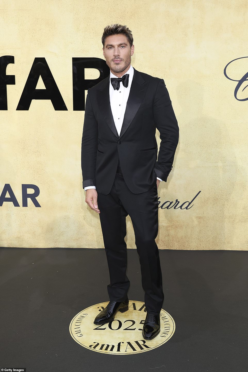 Celebrity hairstylist Chris Appleton cut a dapper figure in a black tuxedo