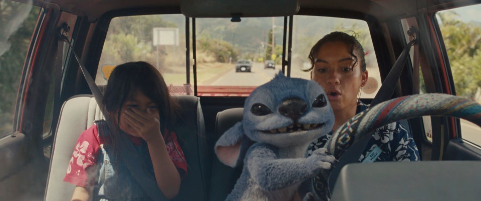 Still from *Lilo & Stitch*, showing Maia Kealoha and Sydney Agudong in a car with Stitch.