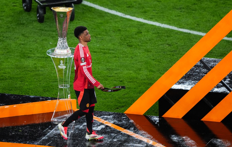 Amad Diallo of Manchester United walks past the UEFA Europa League trophy after the final.