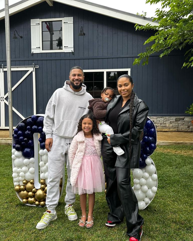 Family photo in front of balloon number 8.